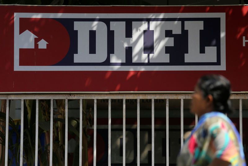 FILE Photo: A woman walks past a signboard of Dewan Housing Finance Corporation Ltd. (DHFL) outside its office on the outskirts of Mumbai January 31, 2019. (REUTERS/Francis Mascarenhas/Files)