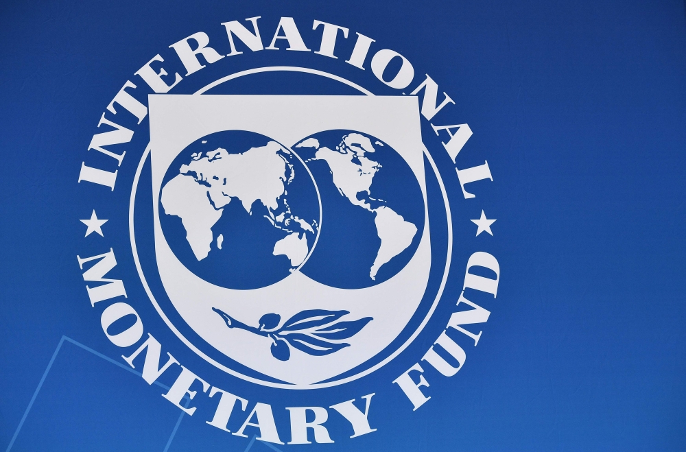 The seal of the International Monetary Fund at IMF Headquarters in Washington. (AFP / MANDEL NGAN)