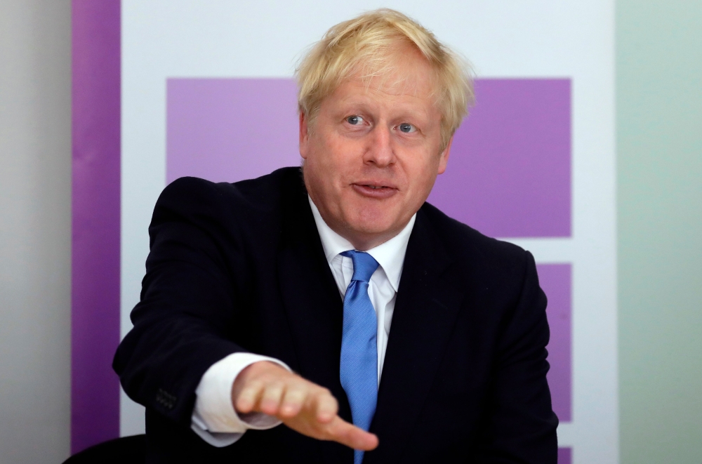 Britain's Prime Minister Boris Johnson speaks at the first meeting of the National Policing Board at the Home Office in London, on July 31, 2019. / AFP / POOL / Kirsty Wigglesworth