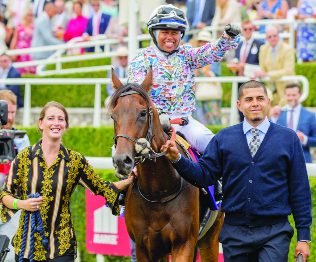 Jockey Khadijah Mellah celebrates after winning the Magnolia Cup on Haverland.