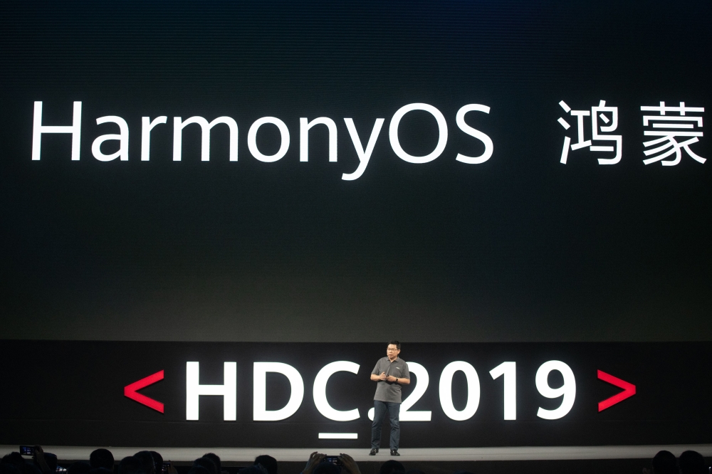 Richard Yu, head of Huawei's consumer business, unveils the company's new HarmonyOS operating system during a press conference in Dongguan, Guangdong province on August 9, 2019. (AFP / FRED DUFOUR)
