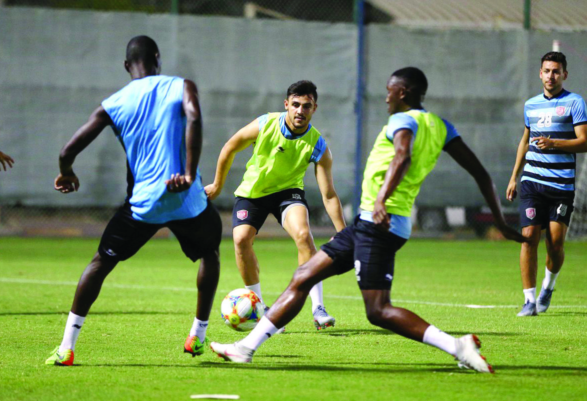 Al Duhail's Bassam Al Rawi (centre) trains with team-mates in preparation for their AFC champions League Round of 16 second leg match against Al Sadd. (Picture: Twitter/@AlSadd)