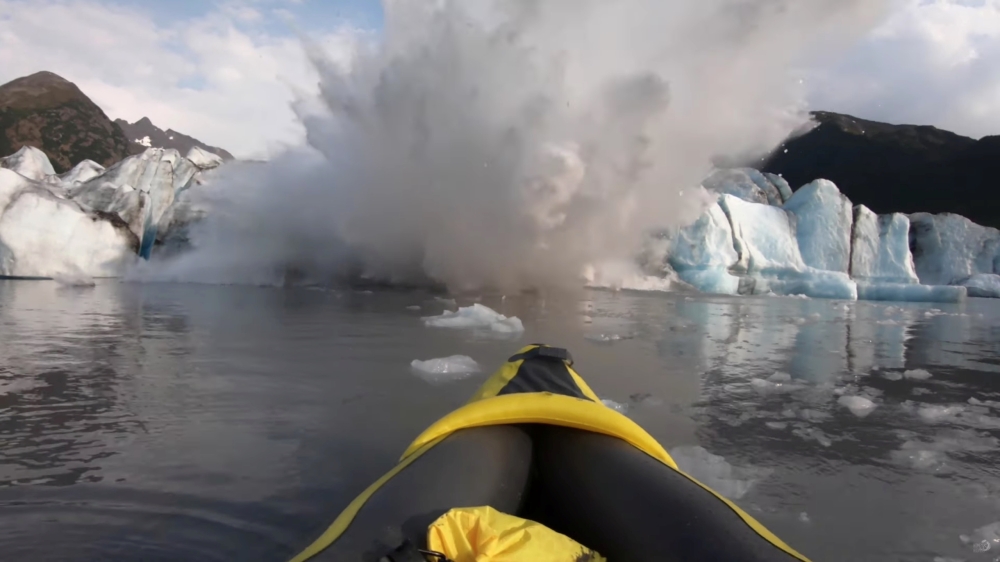 The Spencer Glacier collapses, forming a big wave moments before it crashes into a kayaker, in Alaska, U.S., August 10, 2019, in this still image taken from a video obtained from social media. @steeringsouth/via REUTERS
