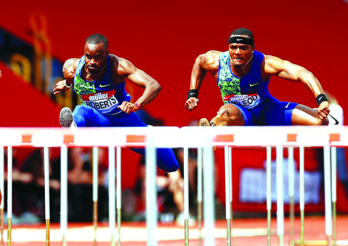 Jamaica’s Omar McLeod (right) wins the Men’s 110 Metres Hurdles final during the Diamond League meet in Birmingham at the Alexander Stadium, Birmingham, Britain on Sunday.