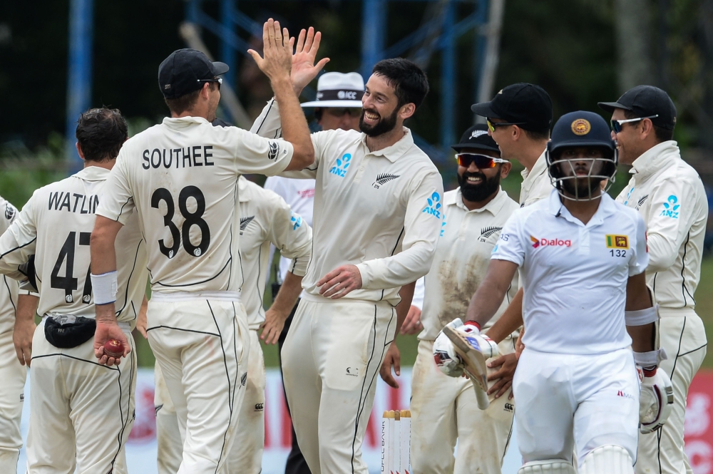 New Zealand's cricketer William Somerville (C) celebrates with his teammates after dismissing Sri Lanka's Kusal Mendis (2R) during the last day of the final Test cricket match between Sri Lanka and New Zealand at P. Sara Oval cricket stadium in Colombo on