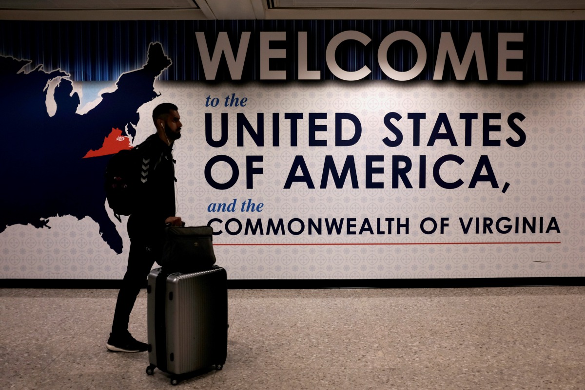 An international passenger arrives at Washington Dulles International Airport in Dulles ,Virginia,  on June 26, 2017. Reuters / James Lawler Duggan