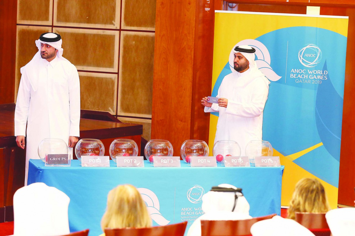 An official picks Tunisia during the official draw ceremony for ANOC World Beach Games’ men’s handball event at the Qatar Olympic Committee headquarters, yesterday. Pictures: Mohamed Farag