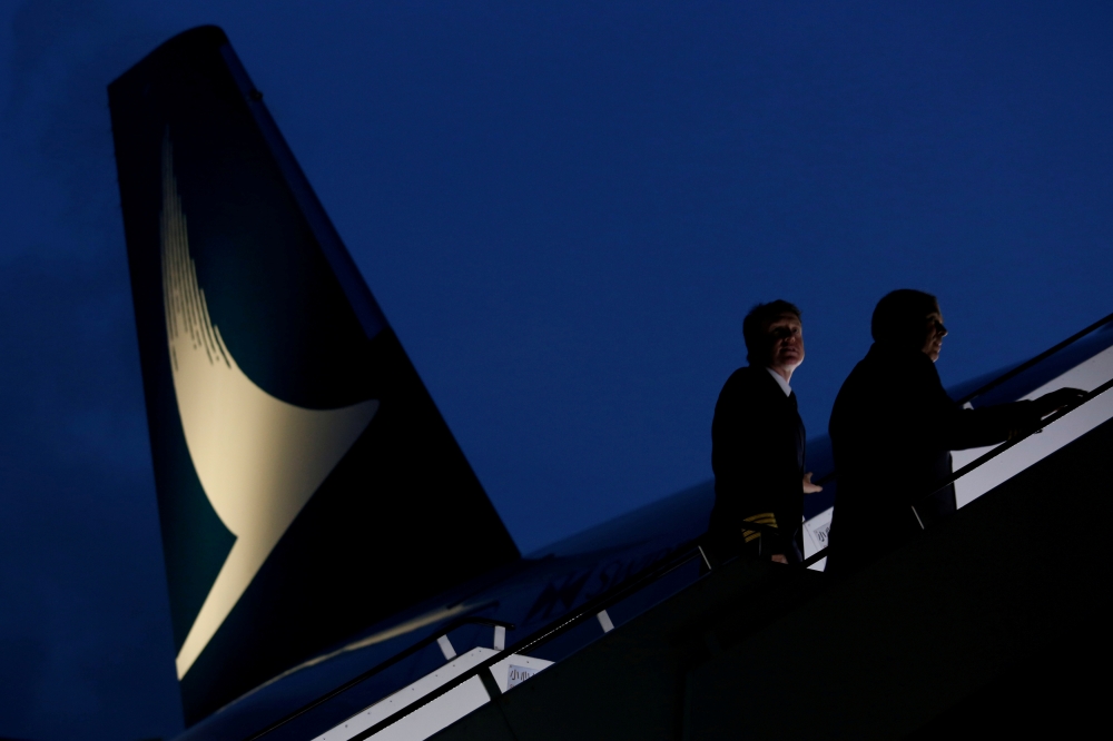 Pilots walk up to a new Cathay Pacific Airways Airbus A350 after being received by the airline at Hong Kong Airport May 30, 2016. Reuters/Bobby Yip
