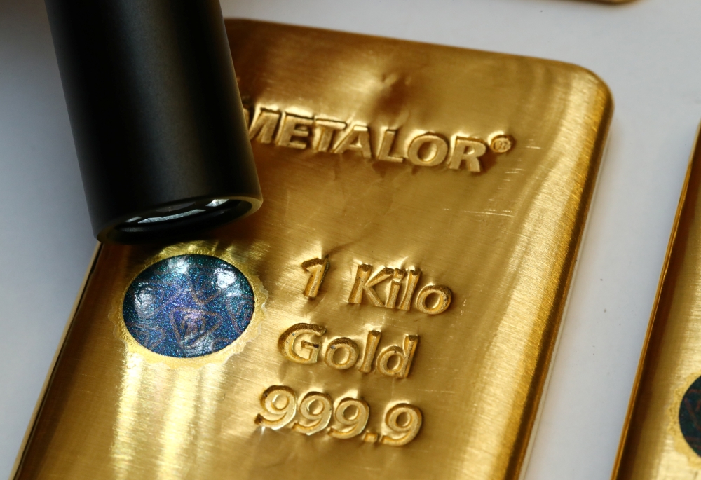 The Sicpa Oasis validator system (bullion protect) is pictured on one kilogram bar of gold at Swiss refiner Metalor in Marin near Neuchatel, Switzerland July 5, 2019. Reuters/Denis Balibouse
 