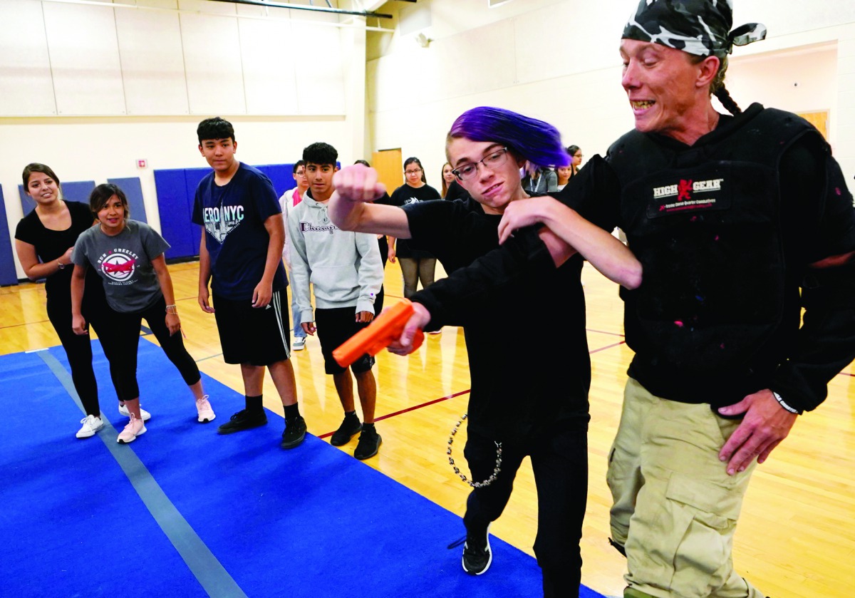 Pinnacle Charter School high school student Christopher Eichman practices taking down a shooter during training for an active shooter situation in a school in Thornton, Colorado, U.S. August 28, 2019. Reuters/Rick Wilking