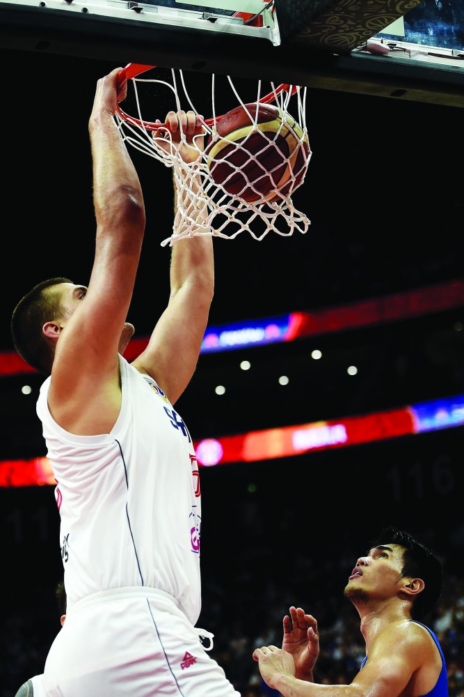 Serbia's Nikola Jokic dunks the ball during the Basketball World Cup Group D game between Serbia and Philippines in Foshan on September 2, 2019. AFP / Ye Aung Thu
