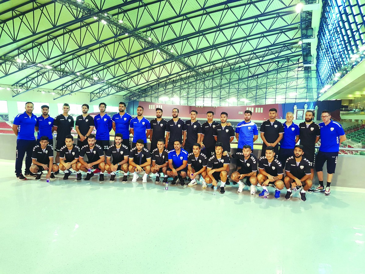 Afghanistan national football team players and officials pose for a photograph during their visit to Doha’s Aspire Academy.