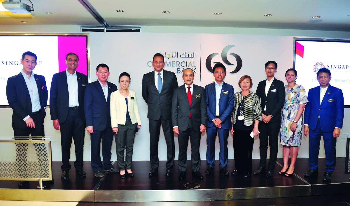 Singapore’s Ambassador to Qatar, Jai S Sohan (fifth left); Commercial Bank Group CEO Joseph Abraham (centre); and other officials posing for a group picture at the SBCQ’s third networking event held at Commercial Bank Plaza. Pic: Abdul Basit/THE PENINSULA