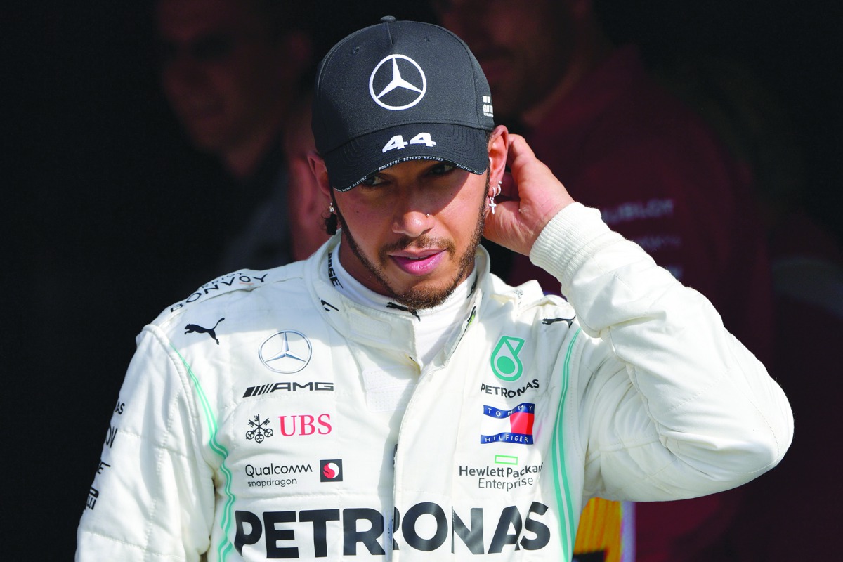 Third placed Mercedes' British driver Lewis Hamilton arrives on the podium after the Italian Formula One Grand Prix at the Autodromo Nazionale circuit in Monza on September 8, 2019. / AFP / Andrej Isakovic
