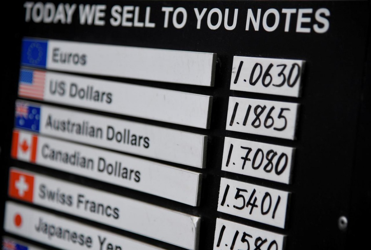 A board displaying buying and selling rates is seen outside of a currency exchange outlet in London, Britain, July 31, 2019. Reuters/Toby Melville
