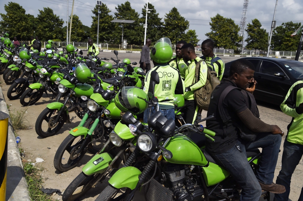 ORide drivers park motorbike taxis to attend meeting at company headquaters, Ikeja in Lagos, on August 19, 2019. AFP / Pius Utomi Ekpei  
