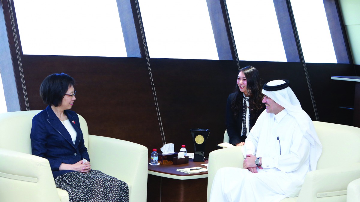 H E Ahmad bin Mohammed Al Sayed (right), Minister of State and Chairman of Qatar Free Zones Authority, discussing investment opportunities with Yin Yicui, Chairwoman of the Shanghai People’s Congress, in his office in Doha, yesterday. 
