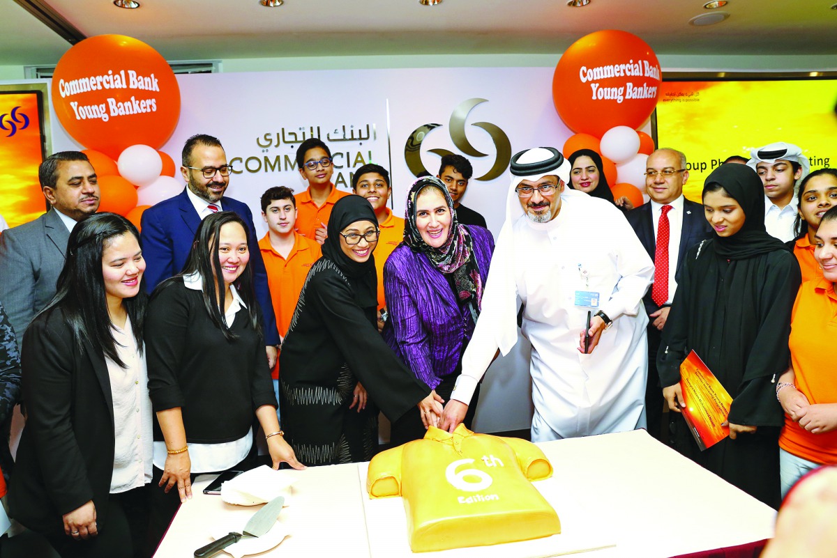 Commercial Bank officials celebrate with the graduates of the ‘Young Bankers Summer Internship Programme 2019’ in Doha recently. 