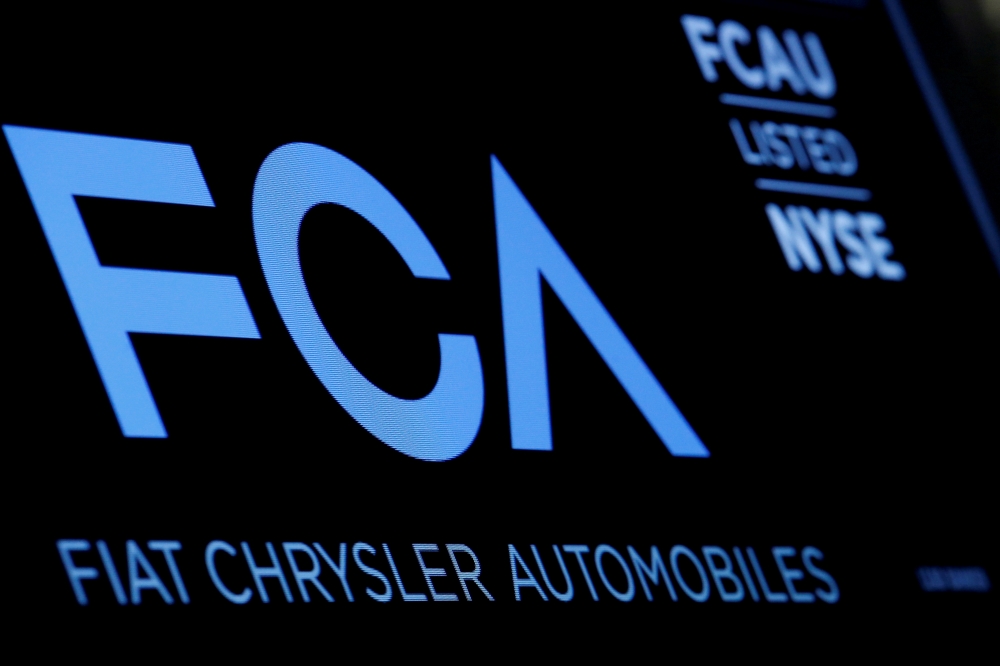 A screen displays the ticker information for Fiat Chrysler Automobiles NV at the post where it's traded on the floor of the New York Stock Exchange, January 12, 2016. Reuters/Brendan McDermid