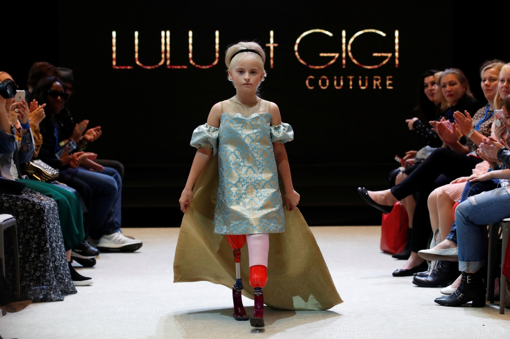 Model Daisy-May Demetre presents a creation by Designer Eni Hegedus-Buiron for luxury children's wear label Lulu et Gigi during Paris Fashion Week in Paris, France, September 27, 2019. REUTERS/Gonzalo Fuentes