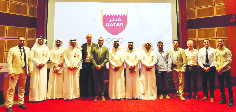 Officials of Qatar and France posing for a group picture.