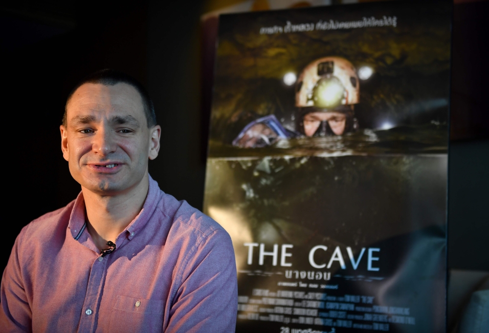 This photo taken on October 1, 2019, shows Belgian diver Jim Warny, who took part in the Thai cave rescue mission in 2018, speaking during an interview in Bangkok. AFP / Lillian SUWANRUMPHA
