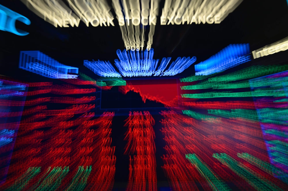 A screen shows the numbers after closing bell at the New York Stock Exchange (NYSE) on September 27, 2019 at Wall Street in New York City.  AFP / Johannes Eisele 