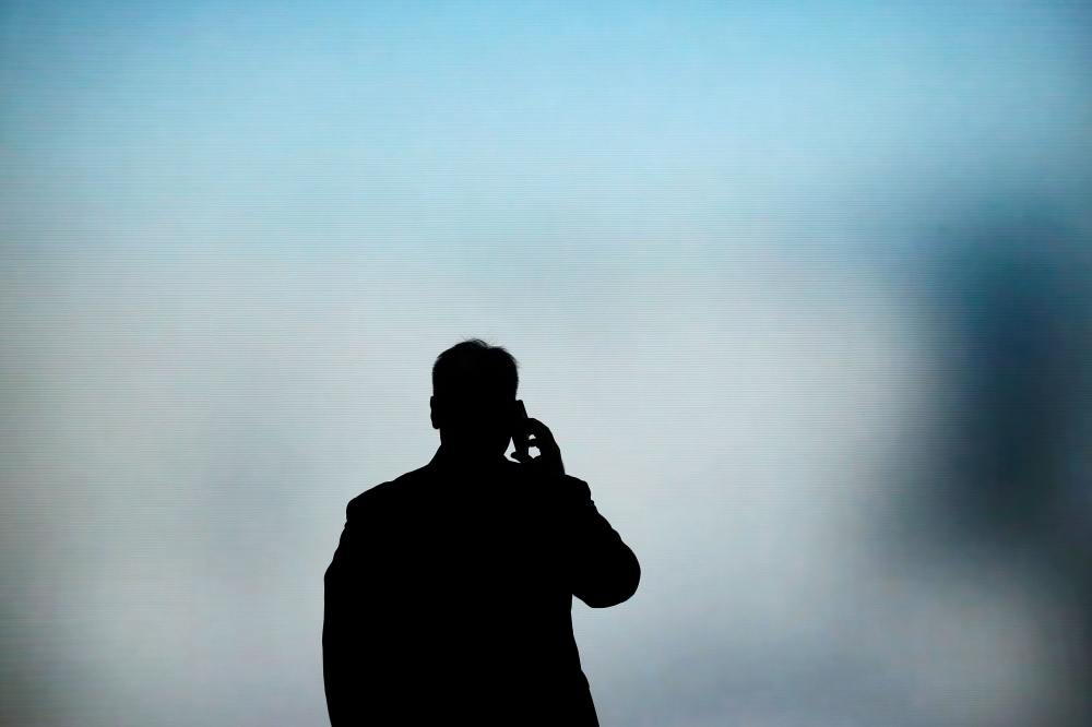 A man talks on his phone at the Mobile World Congress in Barcelona on February 27, 2019. AFP / Pau Barrena