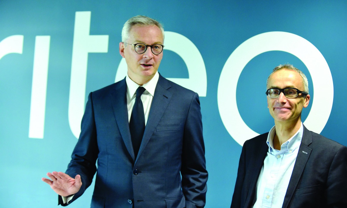 French Finance and Economy Minister Bruno Le Maire (L) and French online advertising company Criteo Co-founder and CEO Jean-Baptiste Rudelle (R) take part in a symposium on the theme 