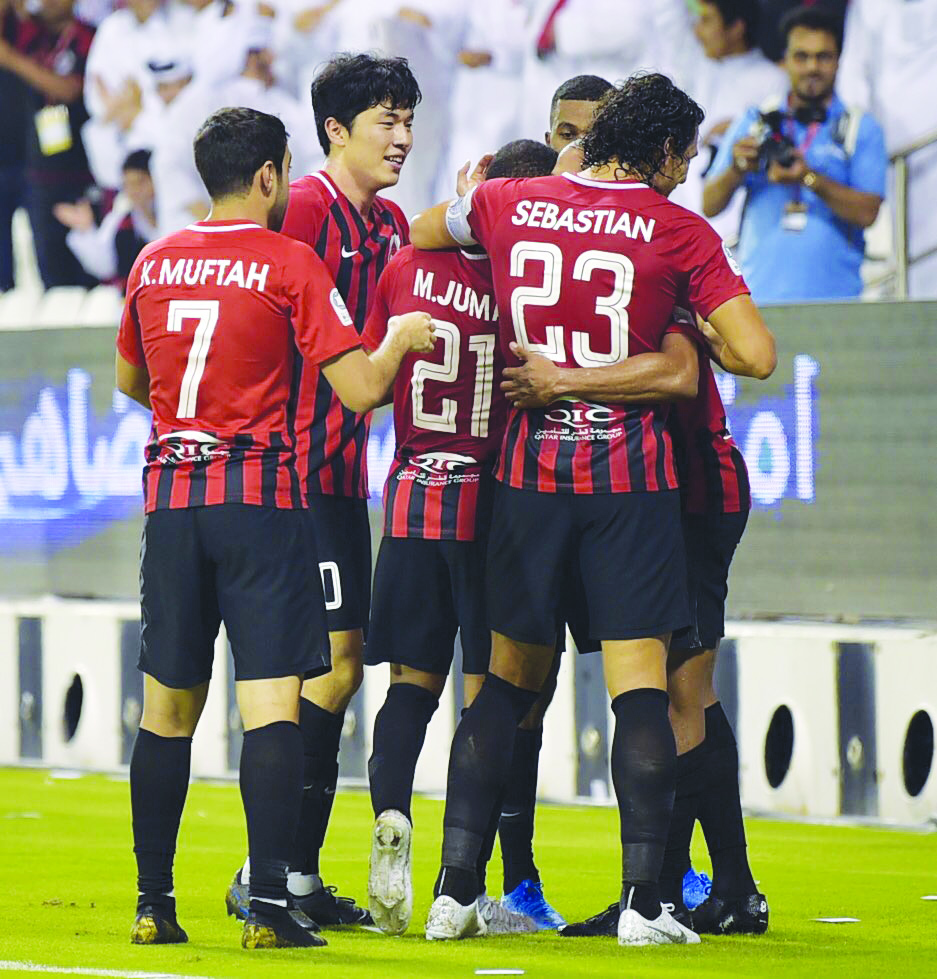 Al Rayyan players celebrate after scoring a goal against Al Sadd during their QNB Qatar Stars League match played at the Jassim Bin Hamad Stadium, yesterday.