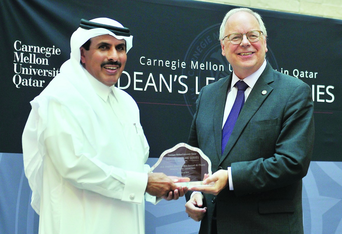 H E Sheikh Abdullah bin Saoud Al Thani (left), Governor of Qatar Central Bank, receiving a memento from the Dean of Carnegie Mellon, Michael Trick, during the Dean Lecture Series on “Qatar’s Strategy for Fintech” held at Carnegie Mellon University in Qata