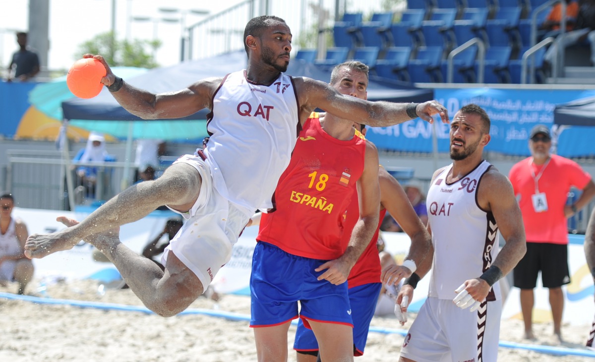 Qatar’s Mutasem Mohamed prepares to shoot against Spain during the preliminary Group B beach handball match played at Al Gharafa, yesterday. Picture: Anvar Sadath 
