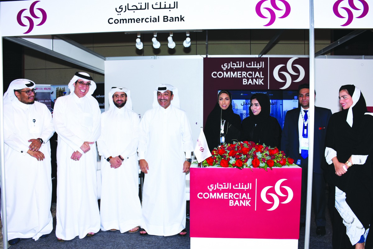 Commercial Bank officials posing for a picture on the sidelines of the event.