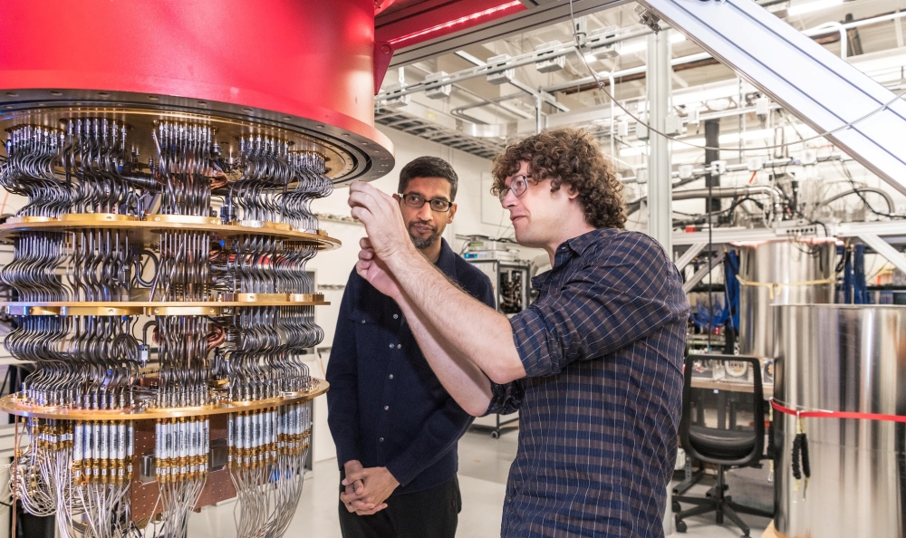 A handout picture from October 2019 shows Sundar Pichai and Daniel Sank (R) with one of Google's Quantum Computers in the Santa Barbara lab, California, U.S. Picture taken in October 2019. Google/Handout via REUTERS 