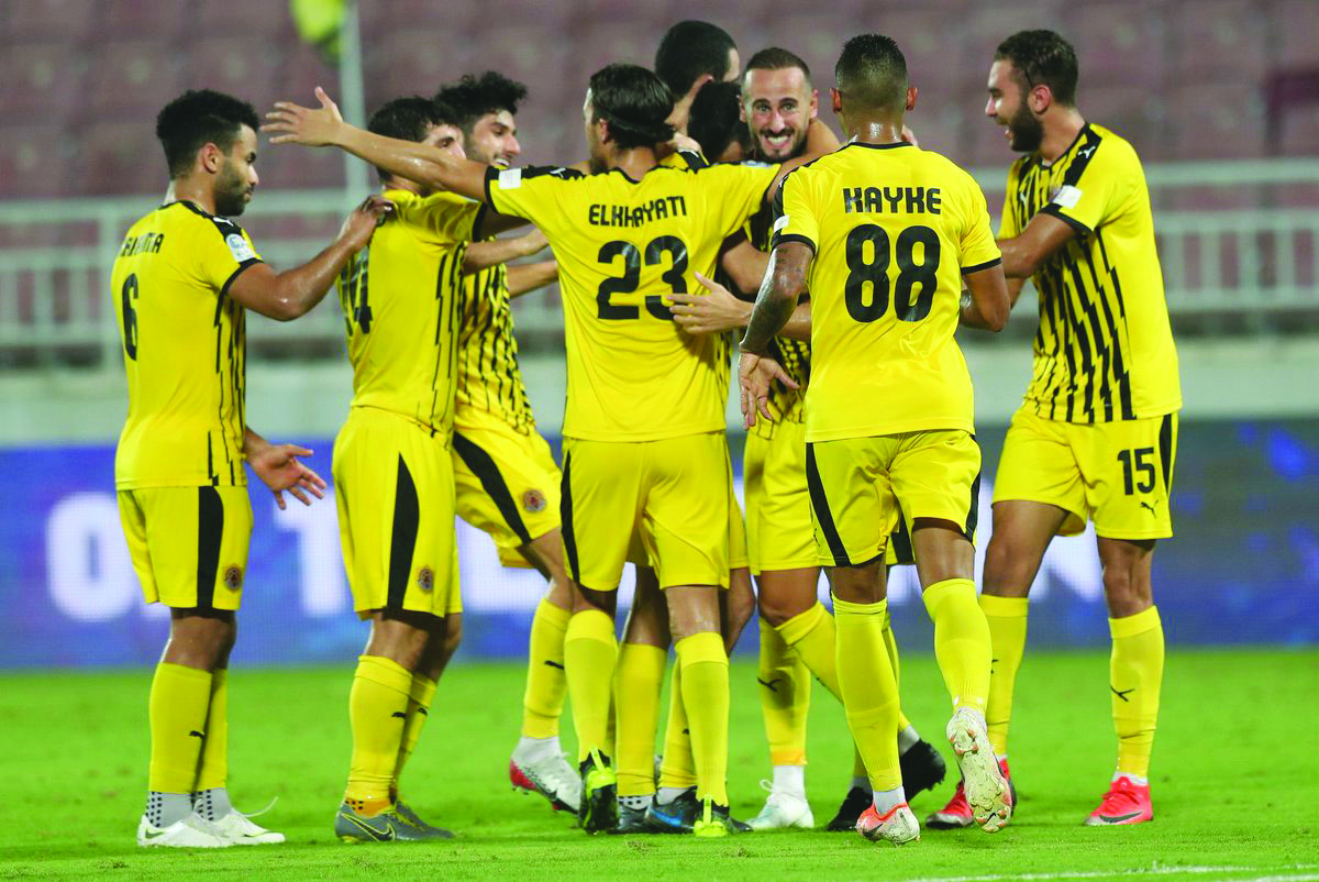 Qatar SC players celebrate a goal against Umm Salal, yesterday. 