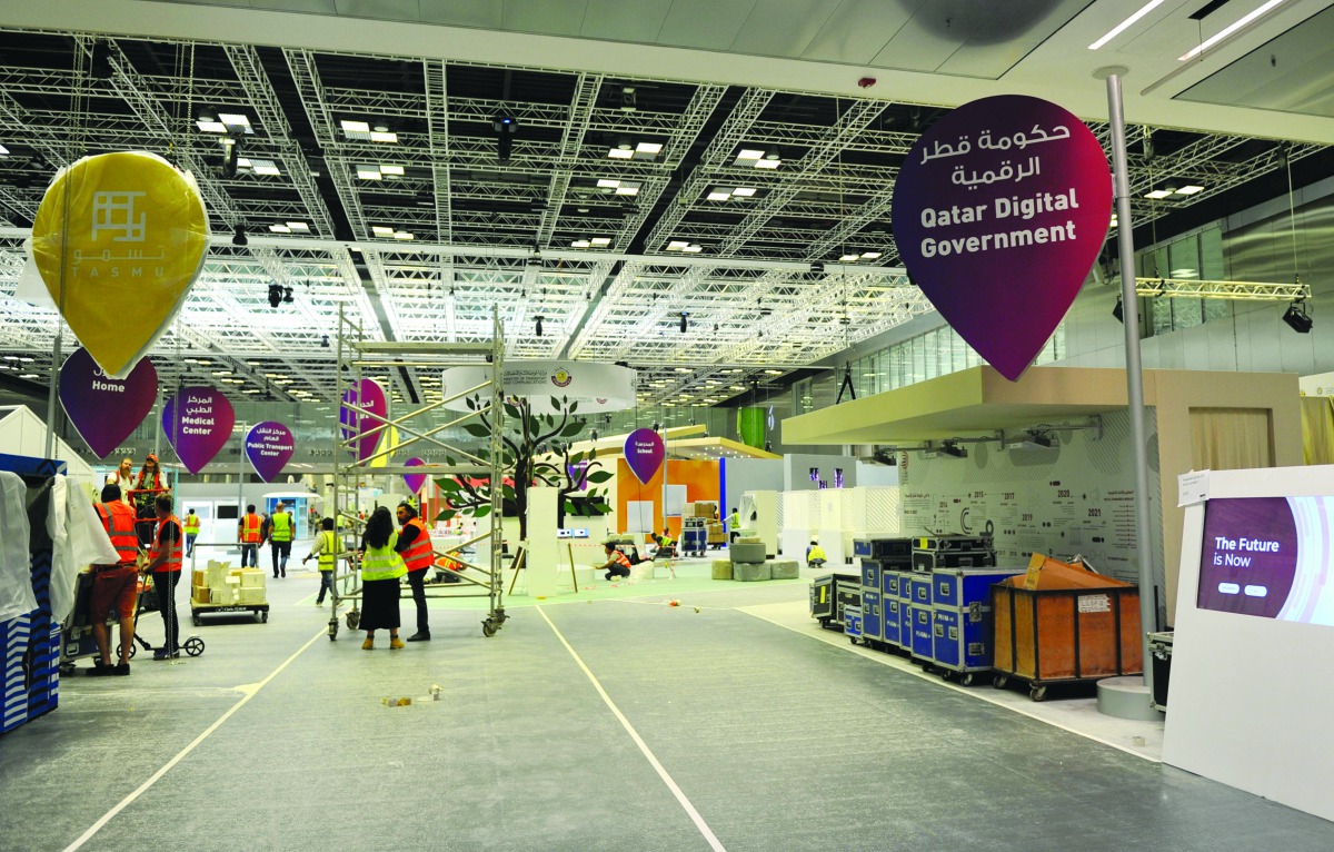 Final preparations taking place at the booths of QITCOM 2019, which will begin tomorrow at QNCC. Pic: Abdul Basit / The Peninsula 
