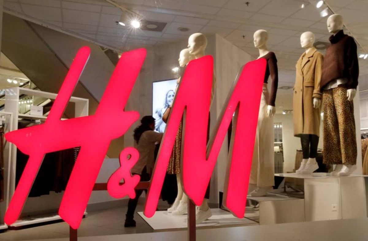 The logo of H and M is seen in a display window of a store in Zurich, Switzerland, January 7, 2019. Reuters / Arnd Wiegmann