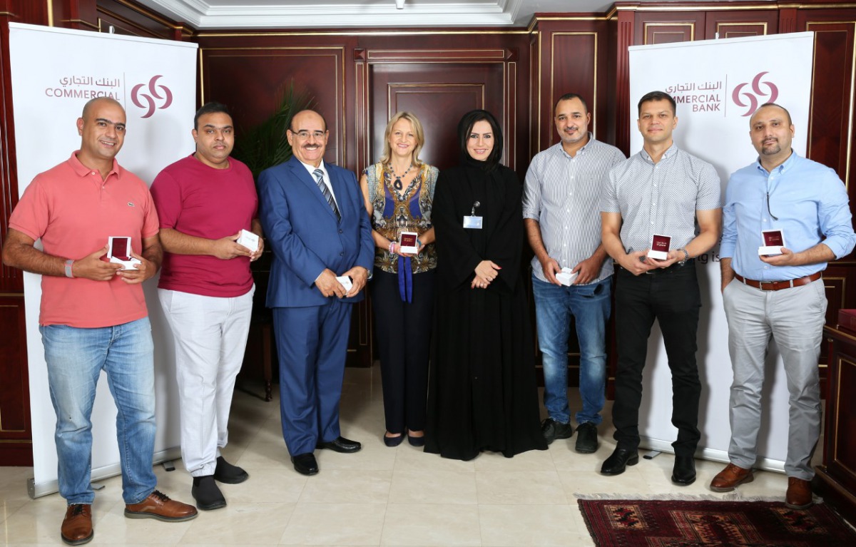 The Golden Summer Winners with Commercial Bank officials.