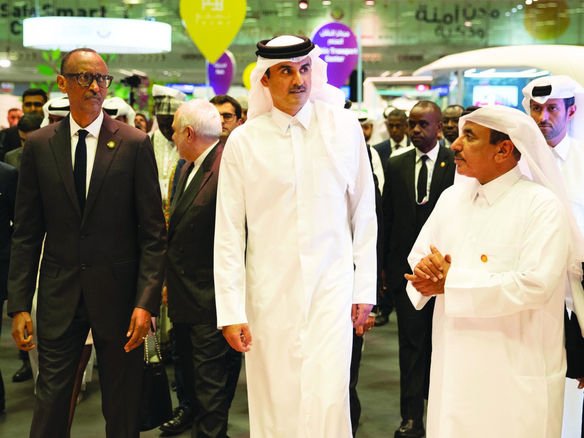 H H the Amir, Paul Kagame and the Minister of Transport and Communications, H E Jassim bin Saif Al Sulaiti, touring the exhibition.