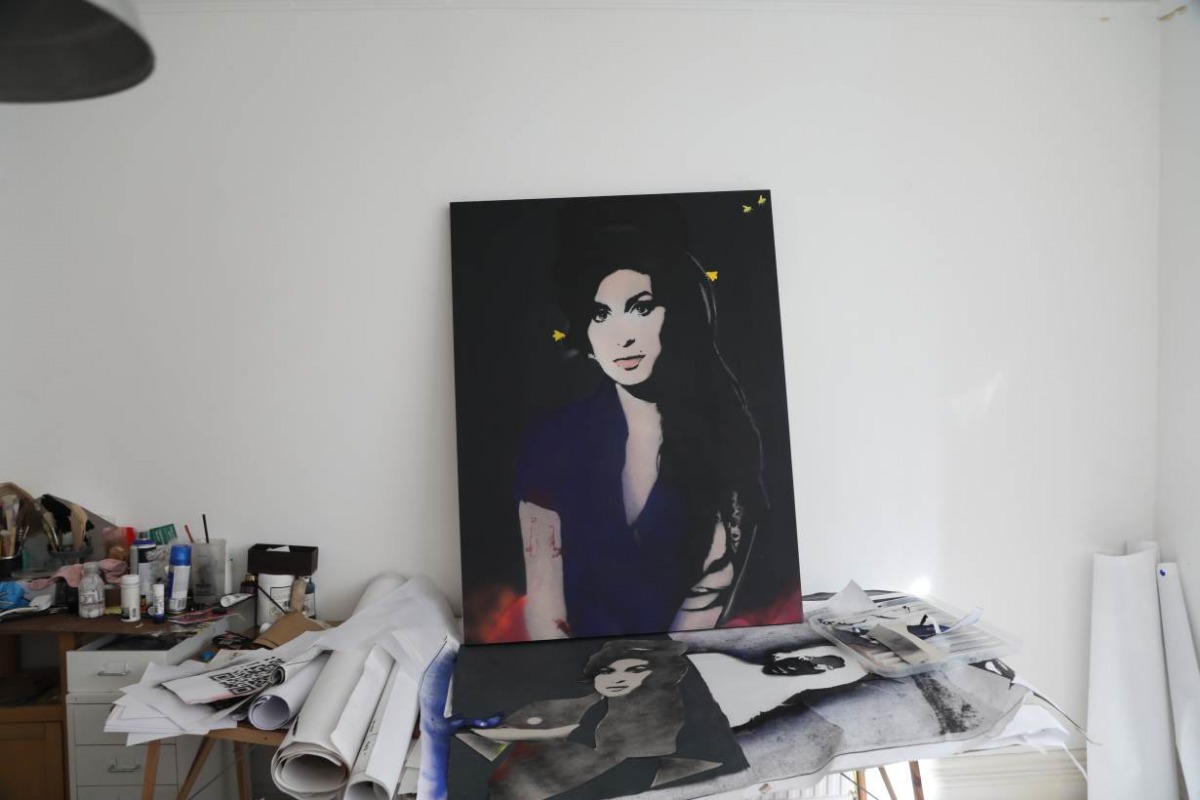 A portrait of British singer Amy Winehouse made by the anonymous female street artist 'Bambi' is depicted in her studio in London, UK on 30 October 2019. Thomson Reuters Foundation/Adela Suliman