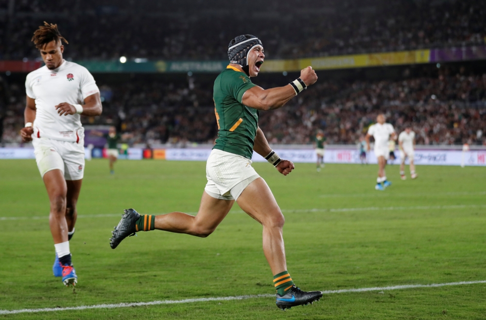 South Africa's Cheslin Kolbe celebrates scoring their second try. REUTERS/Peter Cziborra
