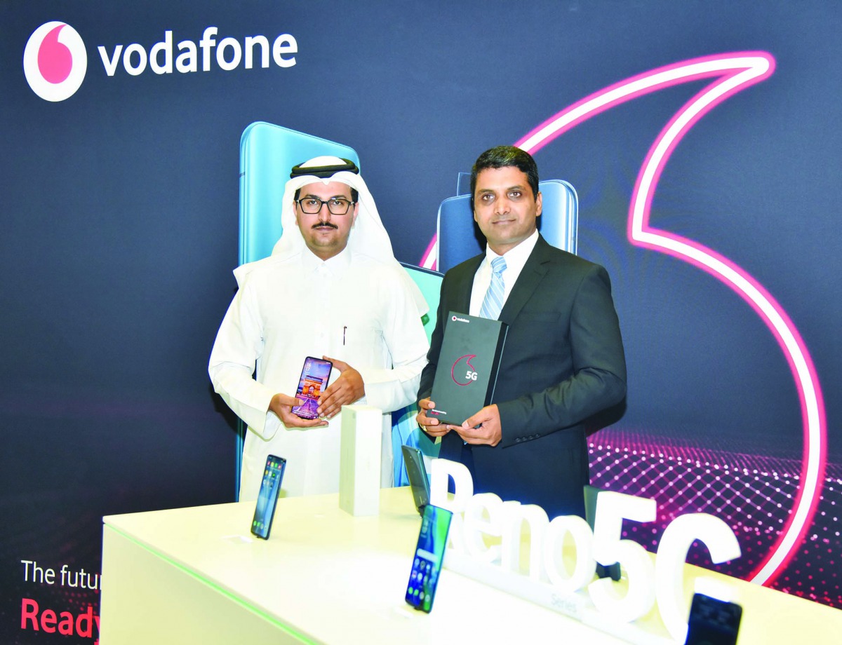 Vodafone Qatar’s Business Services Director, Mahday Saad Al Hebabi (left), and Mohammad Imran, General Manager of Prime Distribution and Trading Company, the exclusive distributors of OPPO in Qatar, holding the OPPO Reno 5G smartphone.