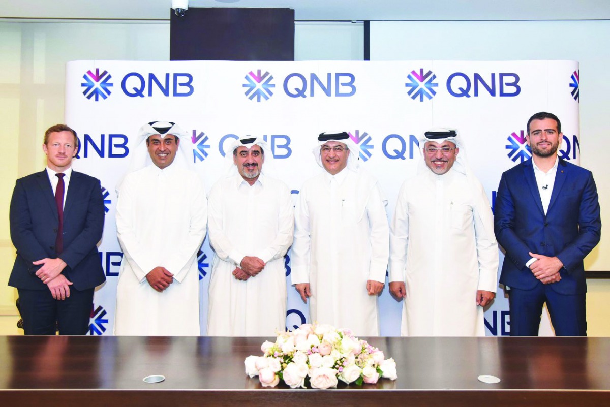The officials of QNB and Porsche Centre Doha, during the signing ceremony.