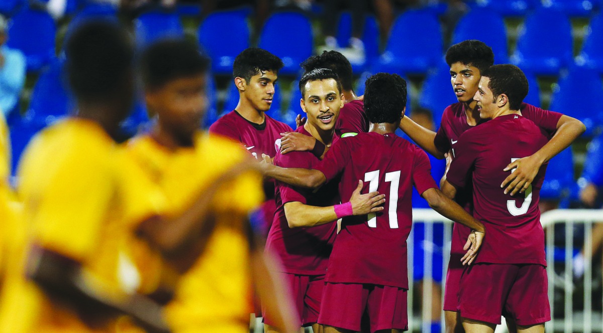 Qatari players celebrate after scoring a goal against Sri Lanka during their AFC U-19 Championship Qualifier in Doha, yesterday. Qatar won 5-1. 