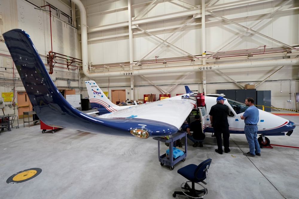 Technicians work on NASA's first all-electric plane, the X-57 Maxwell, at NASA's Armstrong Flight Research Center at Edwards Air Force Base, California, U.S., November 8, 2019. REUTERS/Mike Blake