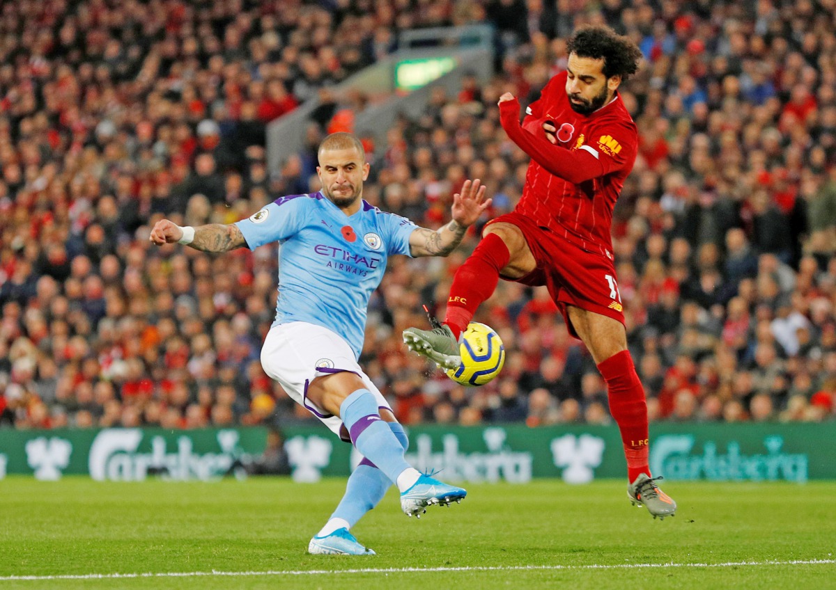 Manchester City's Kyle Walker in action with Liverpool's Mohamed Salah. Reuters/Phil Noble