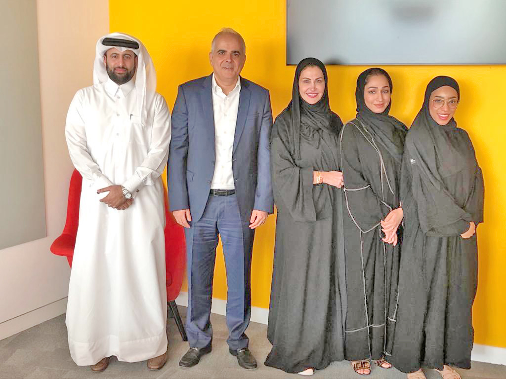 The PwC and QFBA officials after announcing the partnership programme.