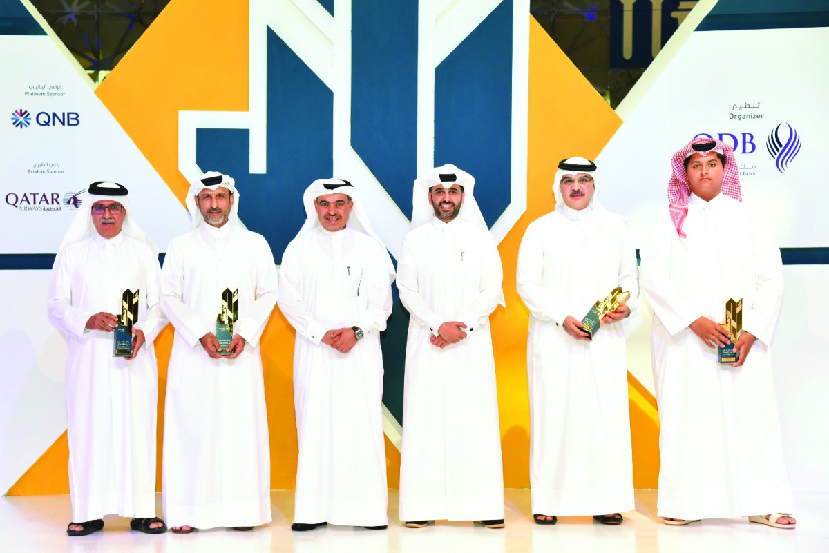 Minister of Commerce and Industry H E Ali bin Ahmed Al Kuwari (third left) and QDB CEO Abdulaziz bin Nasser Al Khalifa (third right) with the winners.