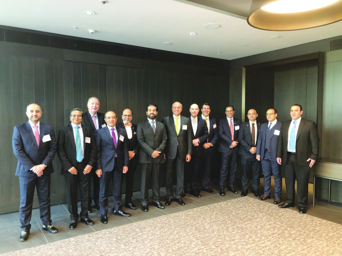 Rashid Al Mansoori (sixth left), CEO of Qatar Stock Exchange; top Qatari bankers and fund managers; and other officials on the sidelines of the forum in London.