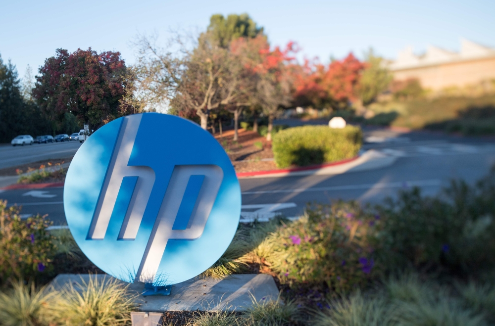 In this file photo taken on November 4, 2016 the HP logo is seen on a sign at Hewlett Packard's headquarters in Palo Alto, California. 
/ AFP / JOSH EDELSON
